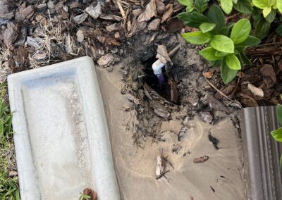 Irrigation leak causing the downspout to come off causing a large amount of water to erode around the AC compressor caught during our Shield Home Watch Service Call in Lakewood Ranch and Manatee County!