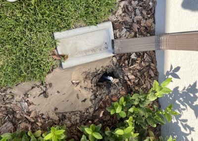 Irrigation leak causing the downspout to come off causing a large amount of water to erode around the AC compressor caught during our Shield Home Watch Service Call in Rosedale Golf and Country Club in Lakewood Ranch and Manatee County!