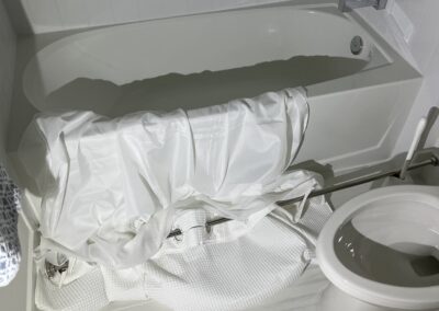 Shower curtain fell down and the curtain was laying over the tub with the toilet open in a LakeHouse Cove at Waterside community caught during our Shield Home Watch Service Call in Lakewood Ranch and Manatee County!