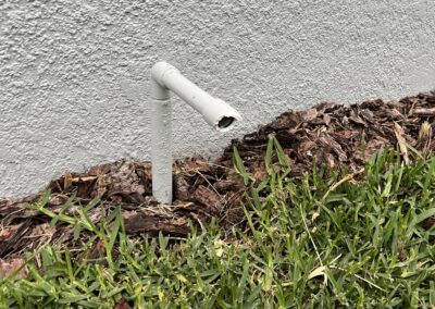 Outside painted AC drain line with damage to the front pipe that prevents debris from entering was witnessed during our Shield Home Watch Service Call in the Cresswind Lakewood Ranch community