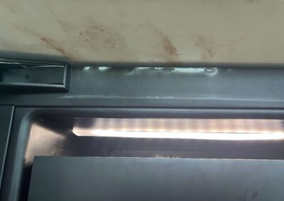 Damaged beverage refrigerator seal causing organic growth around the opening was witnessed during our Shield Home Watch Service Call