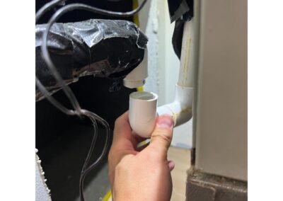 Damaged AC Condensate drain line causing floor flooding and potential water damage in a Del Webb Lakewood Ranch home was identified during our Shield Home Watch Service Call