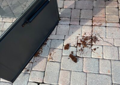 Damaged storm door caused by water and the sun was identified during a Home Watch Service Call in Greenbrook Village in Lakewood Ranch Florida.