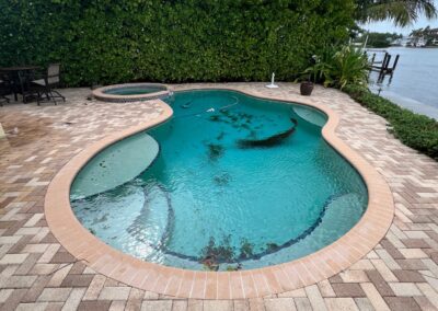 Storm damage after a tropical storm allowing debris to enter the pool was identified during a Home Watch Service Call in Holmes Beach & Anna Maria Island in Manatee County Florida.