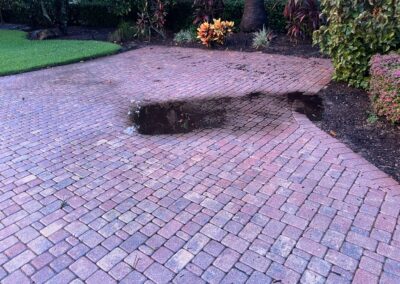Damage from the roofers caused the pavers to sink and cause a small pond was identified during a Home Watch Service Call in the Waterlefe Golf & River Club in Bradenton Florida.