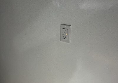 Heavy summer rain can cause external GFIs to trip preventing external security lights to turn on was identified during a Home Watch Service Call in the Waterlefe Golf & River Club in Bradenton Florida.