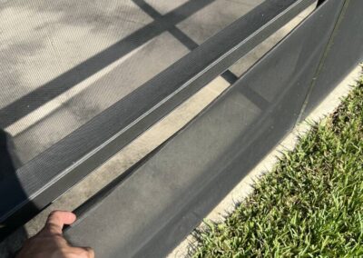 Lanai screen damage caused by wind or wildlife was identified during a Home Watch Service Call in the Waterlefe Golf & River Club in Bradenton Florida.