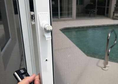 Lanai screen door handle broken off by the pool vendor was caught during our Shield Home Watch Service Call in Rosedale Golf and Country Club in Lakewood Ranch and Manatee County