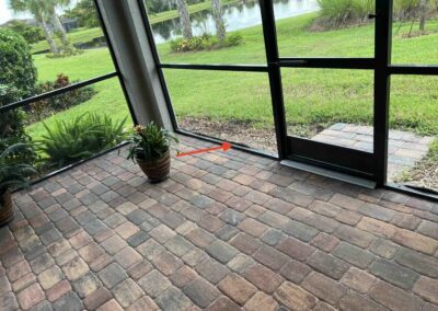 Landscaping mulch bunched up against the lanai screen allowing water to sit against the metal causing corrosion was identified during a Home Watch Service Call in Del Webb Lakewood Ranch in Florida.